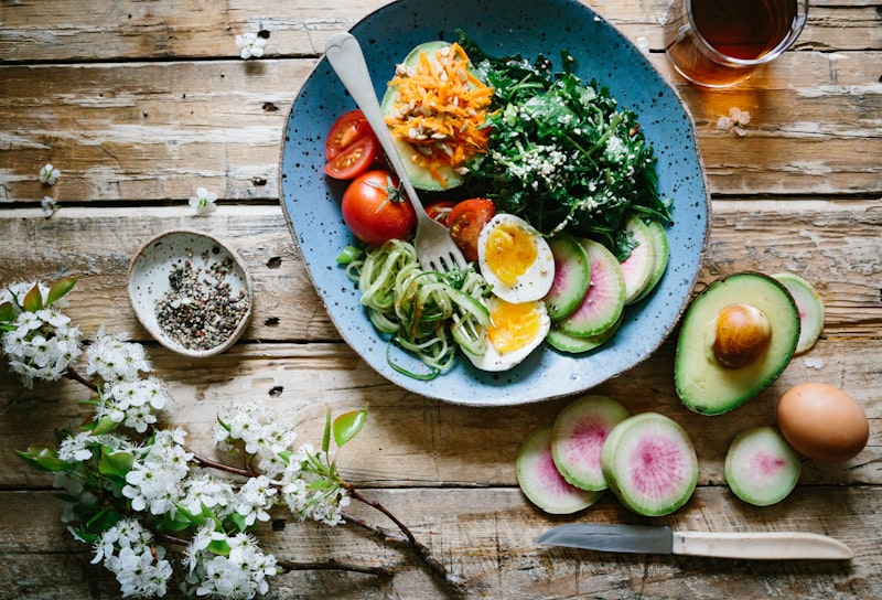 Fresh balanced meal with vegetables and grains on a wooden table
